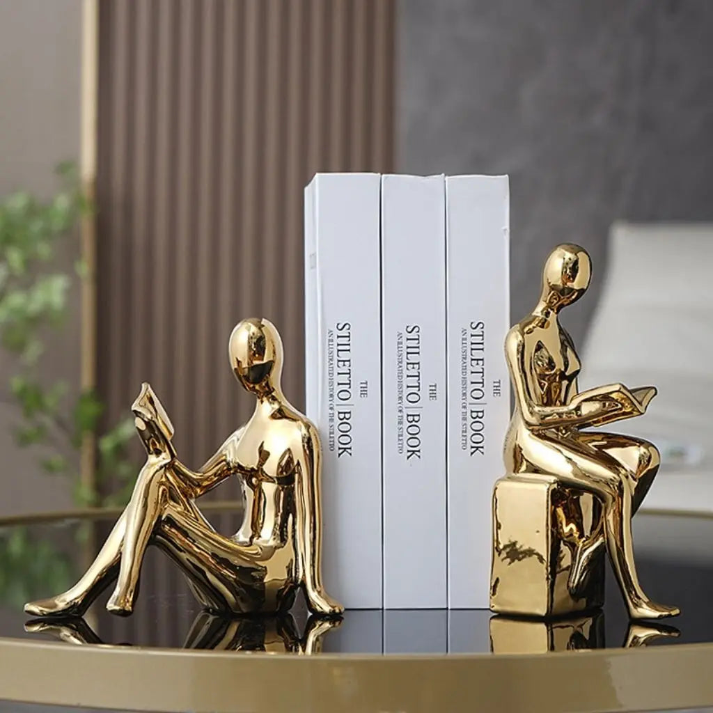 Decorative ceramic book holders featuring artistic reading figures perfect for stylish book storage