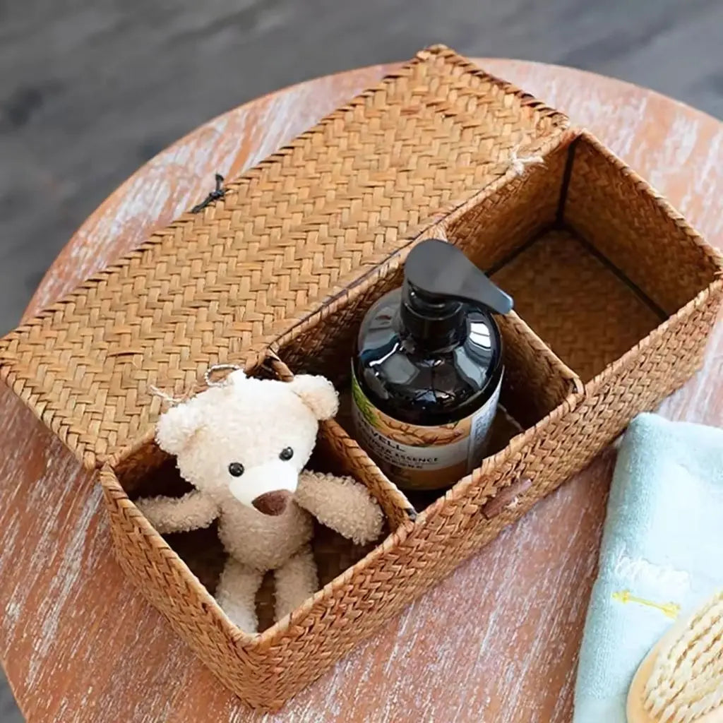 Wicker organizer with secure loop closure showing three separate storage compartments