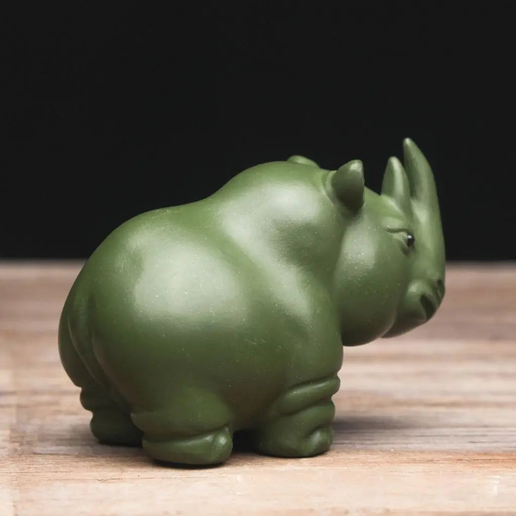 Traditional Chinese tea pet rhino ornament handcrafted from purple sand clay for tea ceremonies