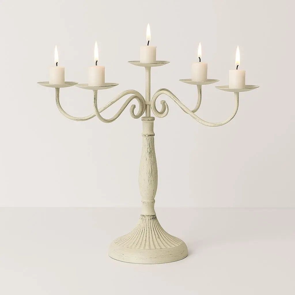rnate metal candelabra with decorative scrollwork base holds multiple taper candles wedding centerpiece