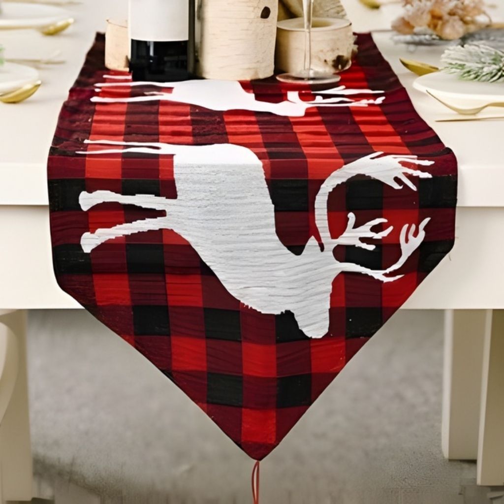 Christmas table runner with detailed holiday patterns and fringe detail