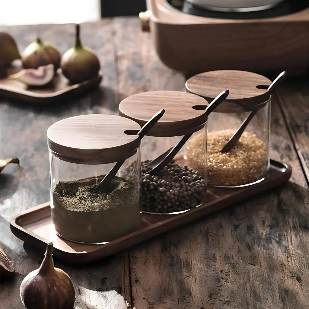 Airtight glass spice jars with wooden lids for fresh seasoning storage and cooking.