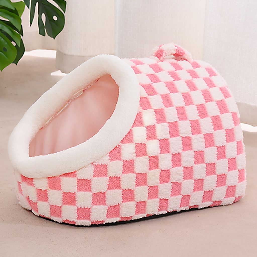 Front facing view of semi enclosed dog bed with checkered exterior and warm interior space