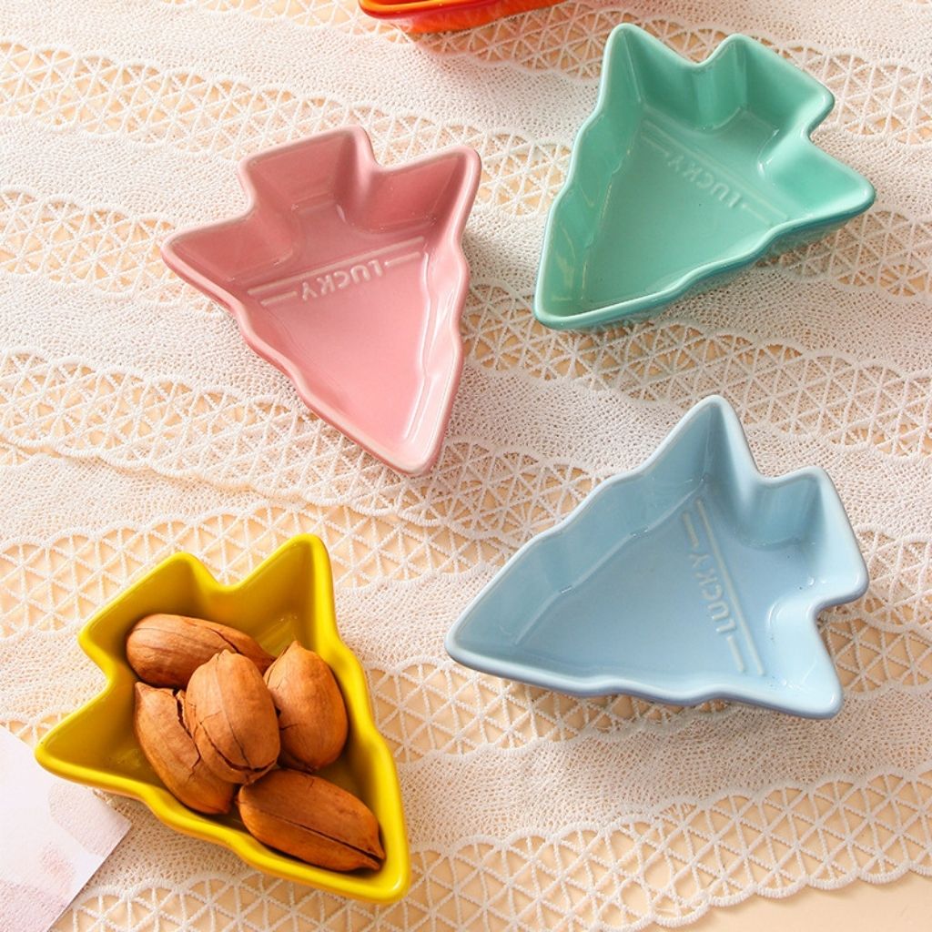 Gradient rainbow porcelain dishes in tree formation showing smooth ceramic finish and tiered arrangement