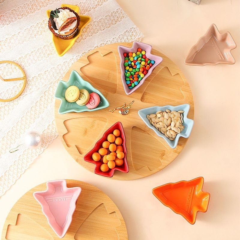 Colorful tree shaped porcelain trays stacked vertically showing gradient finish from green to pink tones