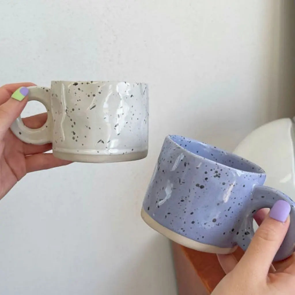 Top view of speckled ceramic coffee mug showing interior capacity and artisan glaze details.