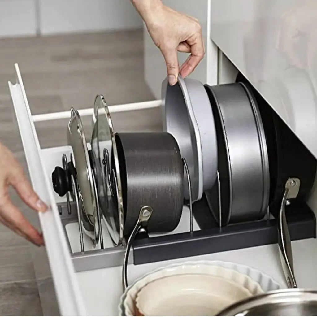 Kitchen lid organizer rack made from stainless steel for cabinet cookware storage solutions.