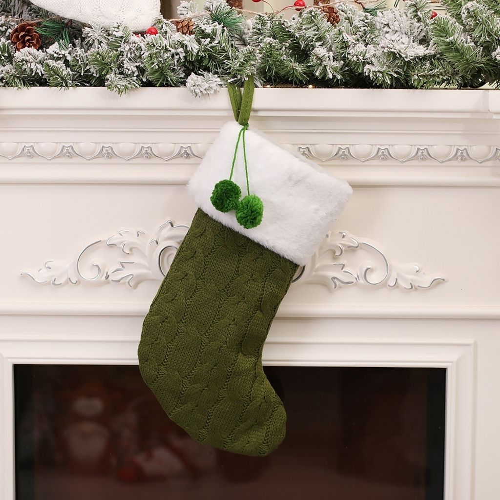Knitted christmas stocking with decorative pattern and cuff detail