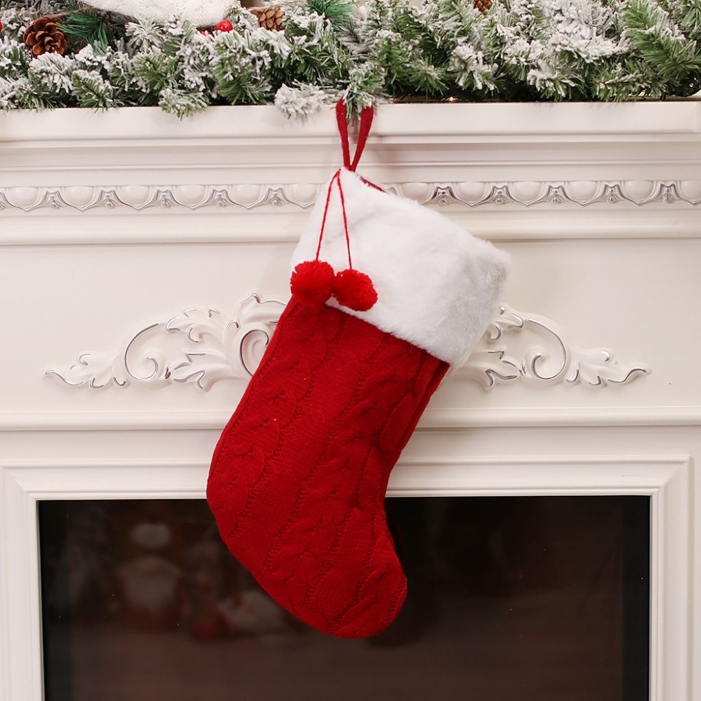 Holiday stocking in knitted fabric with traditional festive design