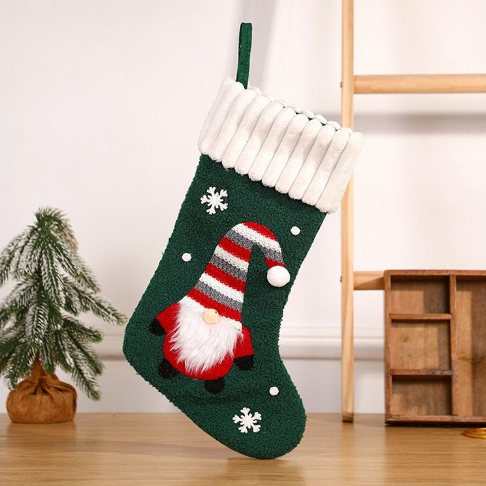 Christmas stocking with gnome design showing detailed embroidery and plush trim