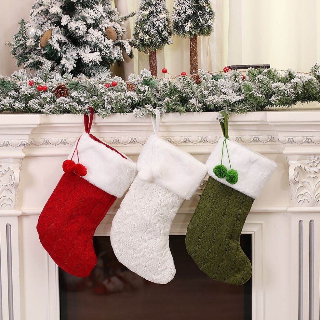 Christmas stocking in knitted fabric with decorative holiday motif