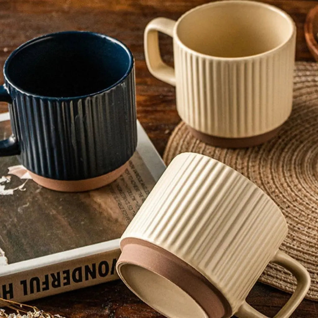 Handcrafted ceramic mug featuring artisan striped pottery design, stylish coffee accessories for kitchen decor