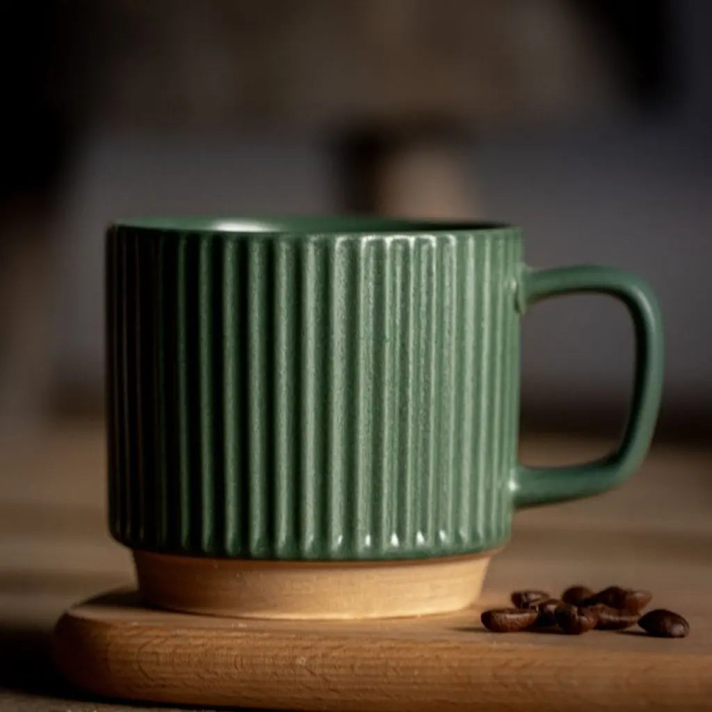 Striped ceramic mug displaying ribbed texture and natural aesthetic, versatile pottery coffee cup design