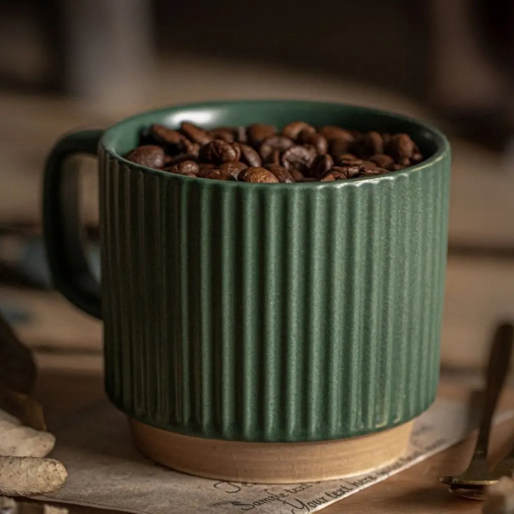 Ceramic drinkware with distinctive textured stripes, functional pottery cup ideal for morning coffee rituals