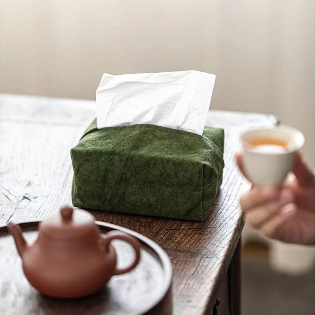 Neutral suede tissue box holder with stitched edges perfect for living room and office decor coordination