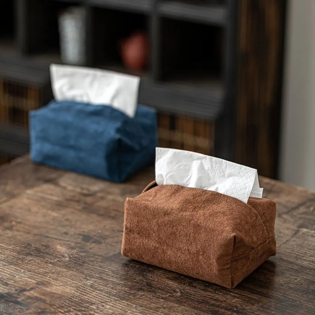 Soft suede-like tissue cover with decorative stitching enhances interior design and room decor aesthetics