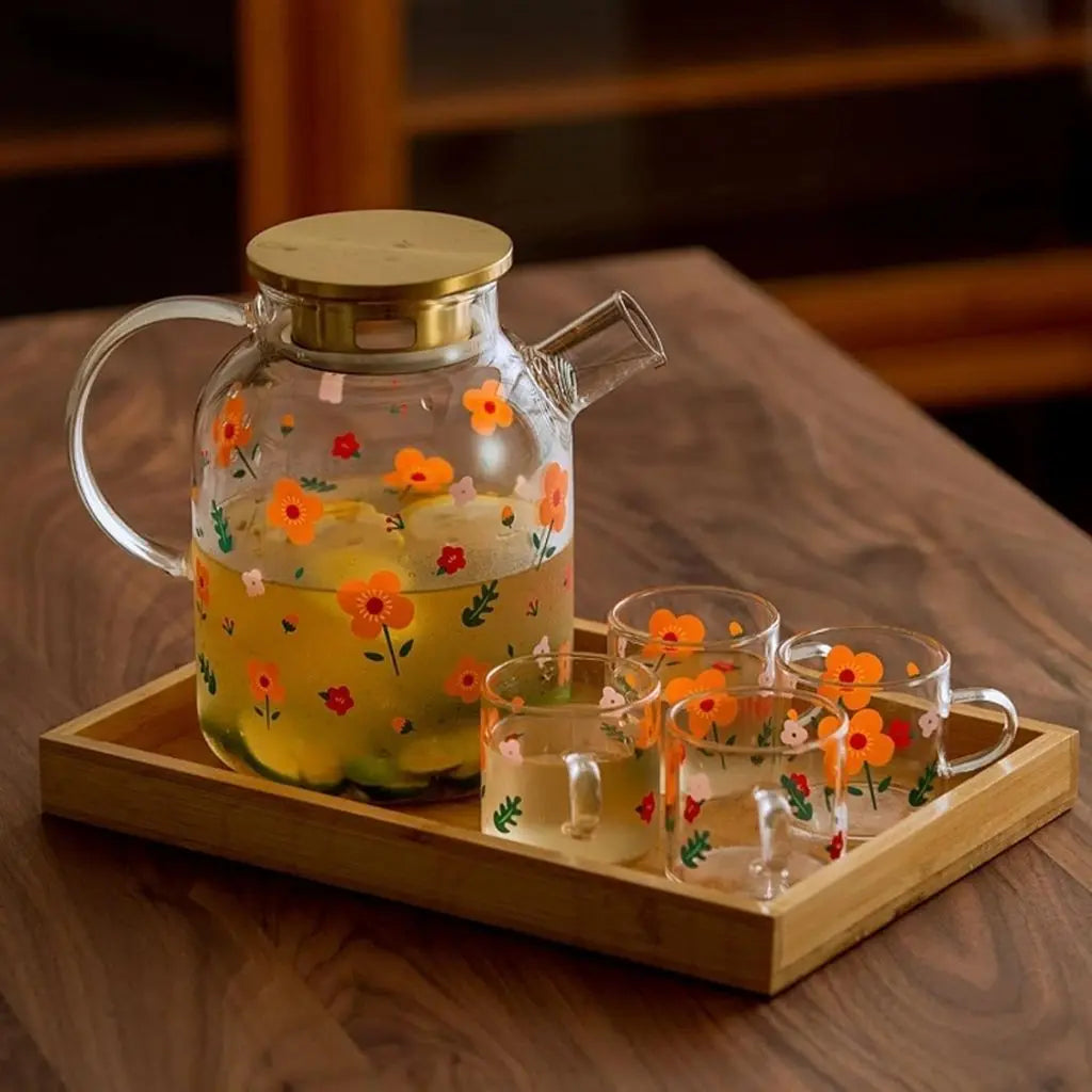 Modern sunflower borosilicate glass tea kettle set with contemporary teaware design