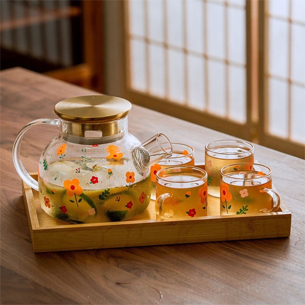 Premium glass tea service featuring sunflower kettle and heat proof borosilicate teapot