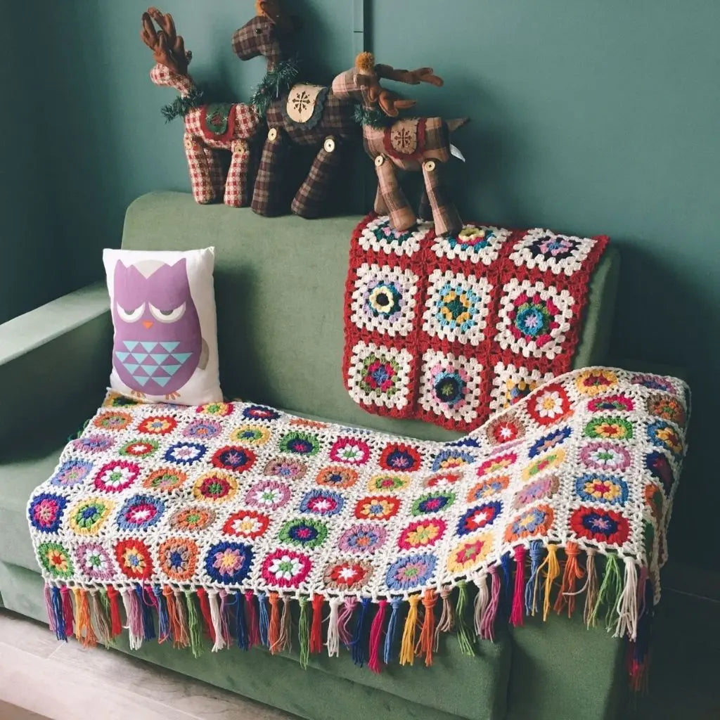 Tassel crochet blanket with handmade floral design perfect for bohemian home styling