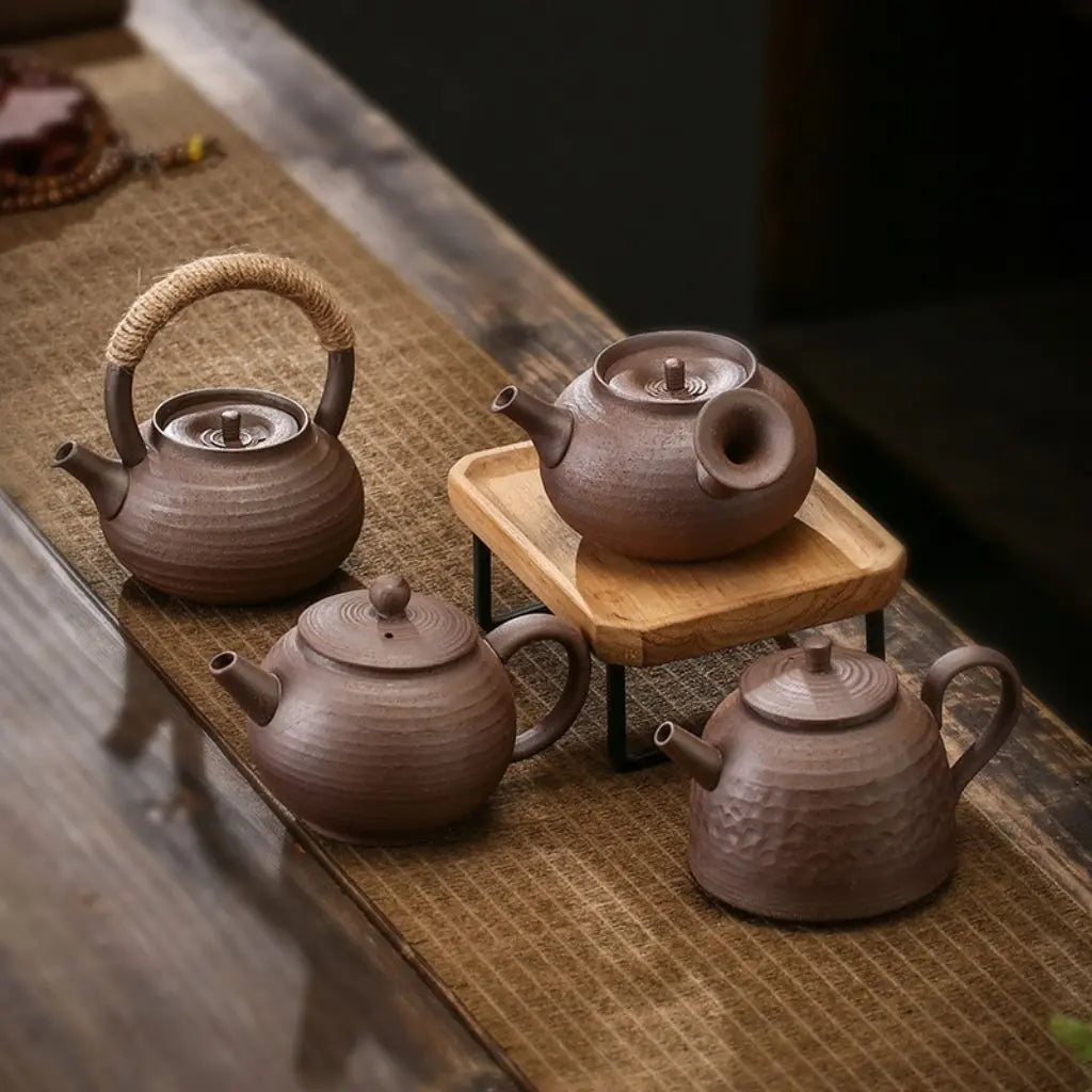 Traditional ceramic tea pot with authentic pottery finish, designed for both casual and ceremonial brewing