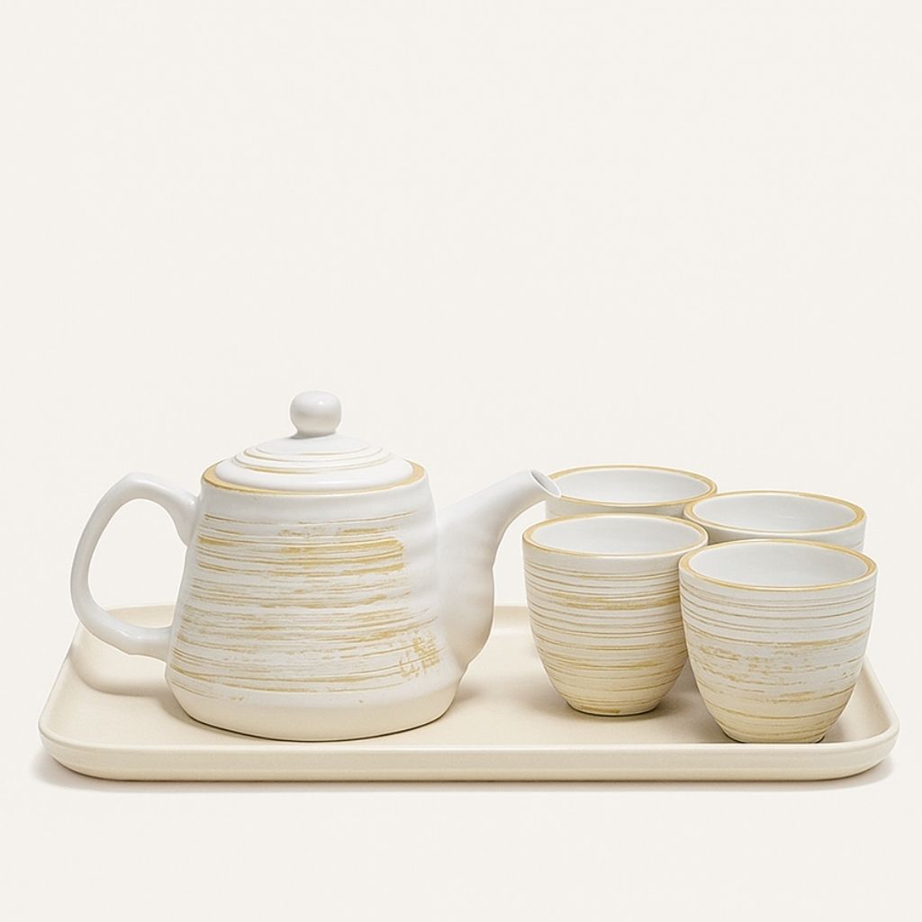 Nordic ceramic teapot with matching cups featuring textured matte glaze and retro design