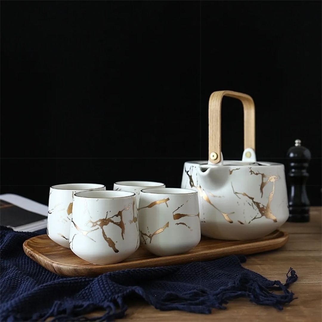 Close up of marble glaze ceramic finish on modern tea set with smooth texture