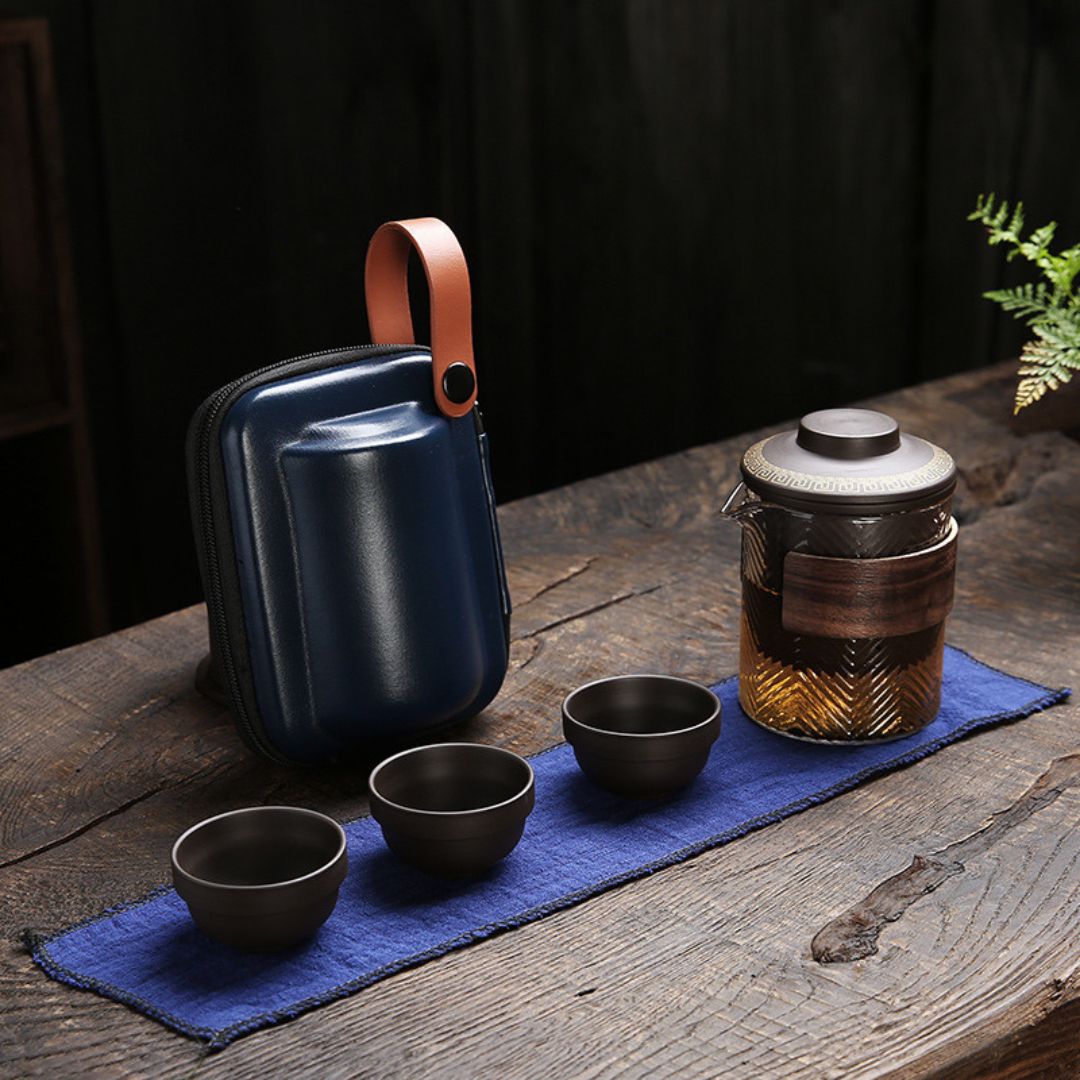 Portable tea ceremony kit with purple sand teapot cups and bamboo accessories in case