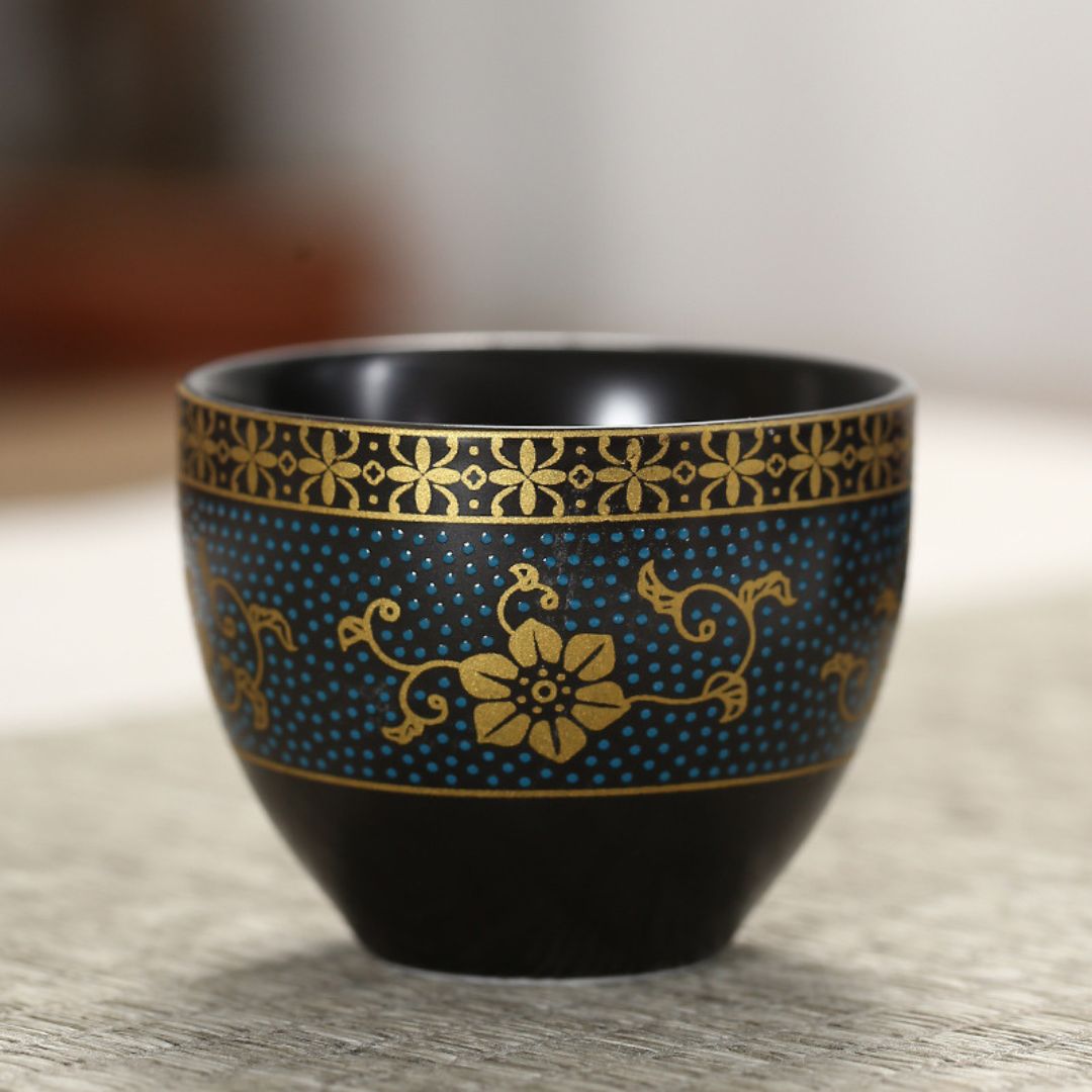 Glazed black ceramic teapot with gold detailing holds 220ml for small batch brewing