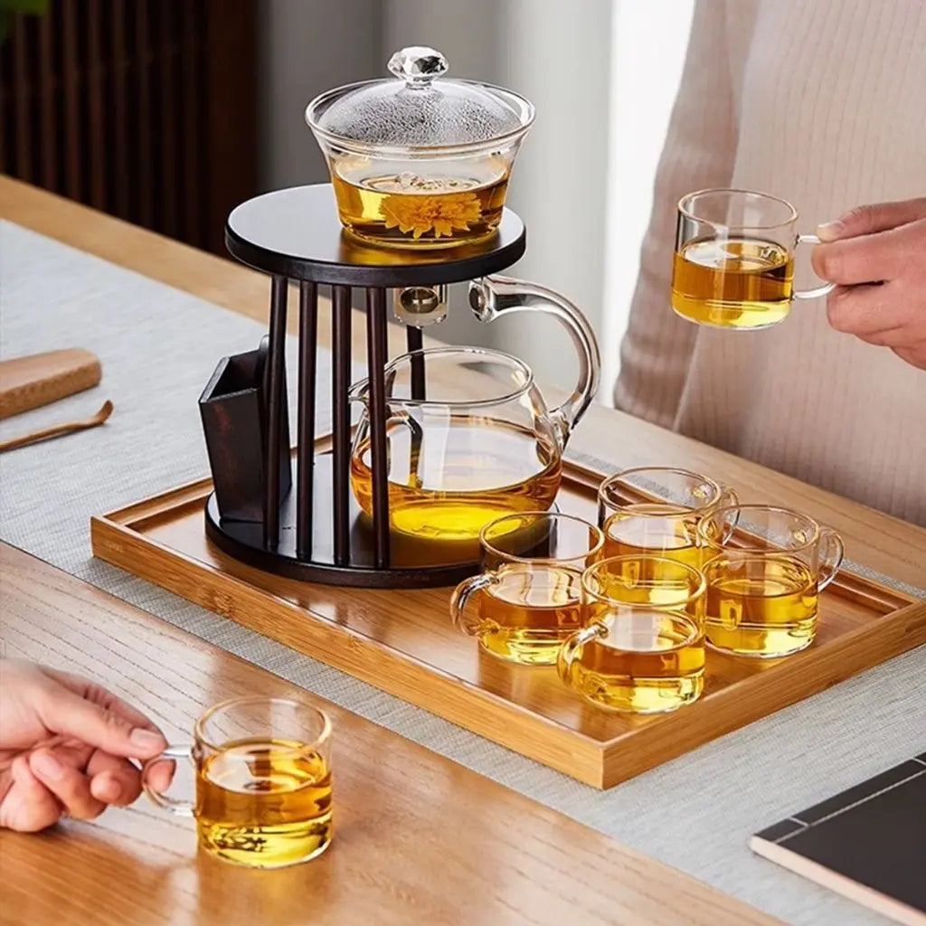 Complete kung fu tea brewing kit with glass teapot, magnetic infuser, and matching tea cups set