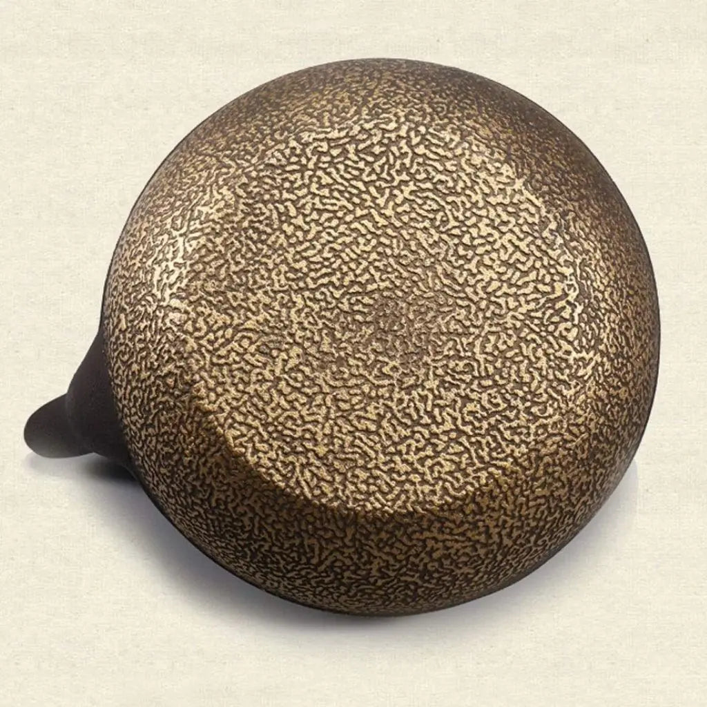 Traditional cast iron tea kettle featuring detailed hand-painted florals and durable construction for heat retention