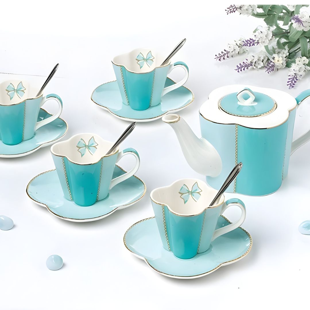 White porcelain tea set with teacups saucers and spoons for tea parties