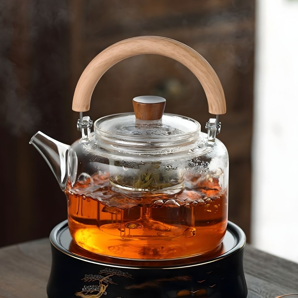 Modern glass teapot featuring natural wooden loop handle and thick borosilicate construction