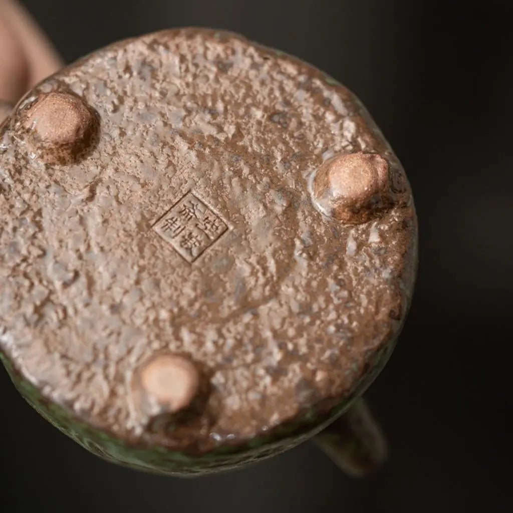 Ceramic teapot spout with bronze glaze finish designed for precise tea pouring and serving