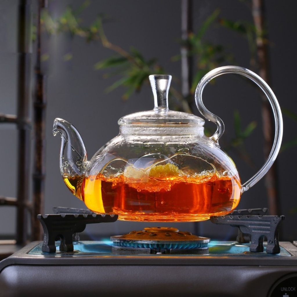 Transparent borosilicate glass teapot showing tea color during steeping process