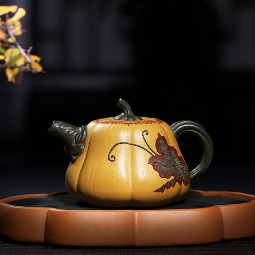 Carved purple sand teapot showing detailed handle and organic texture