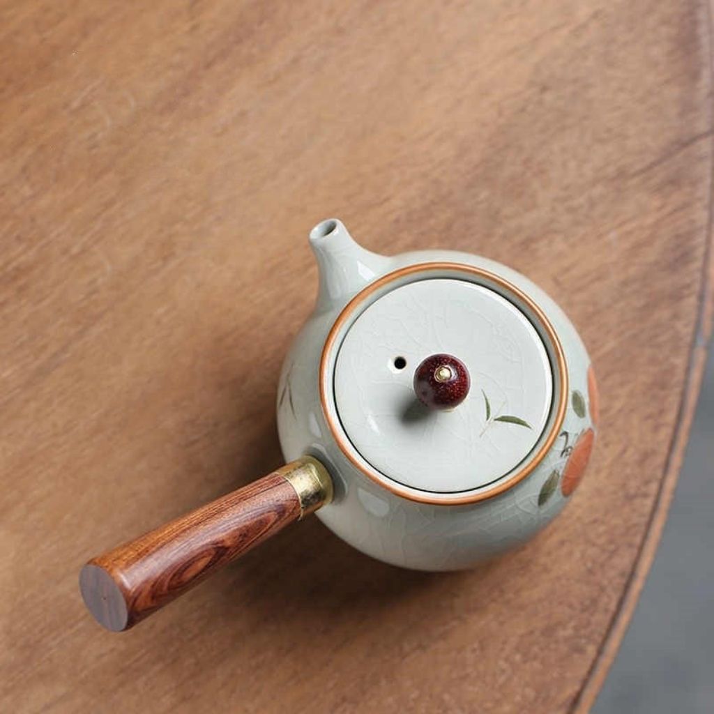 Artisan ceramic teapot with crackle glaze and side mounted handle