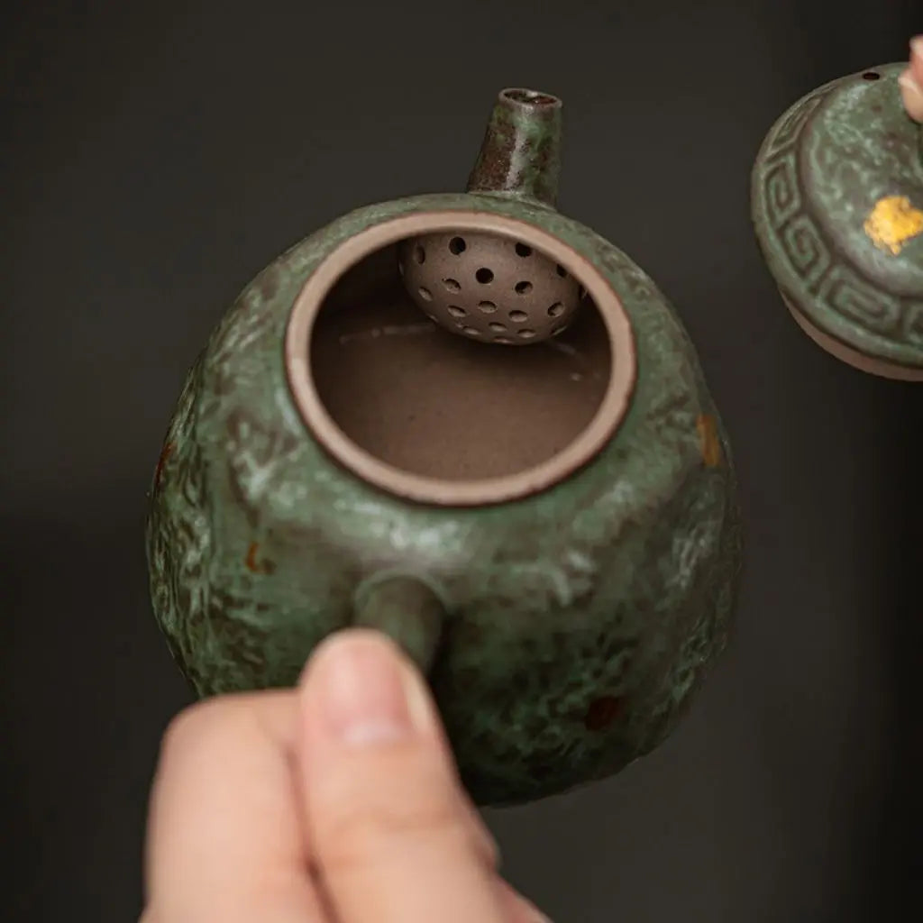 Bronze glazed ceramic teapot featuring textured surface with golden flecks and compact 150ml capacity