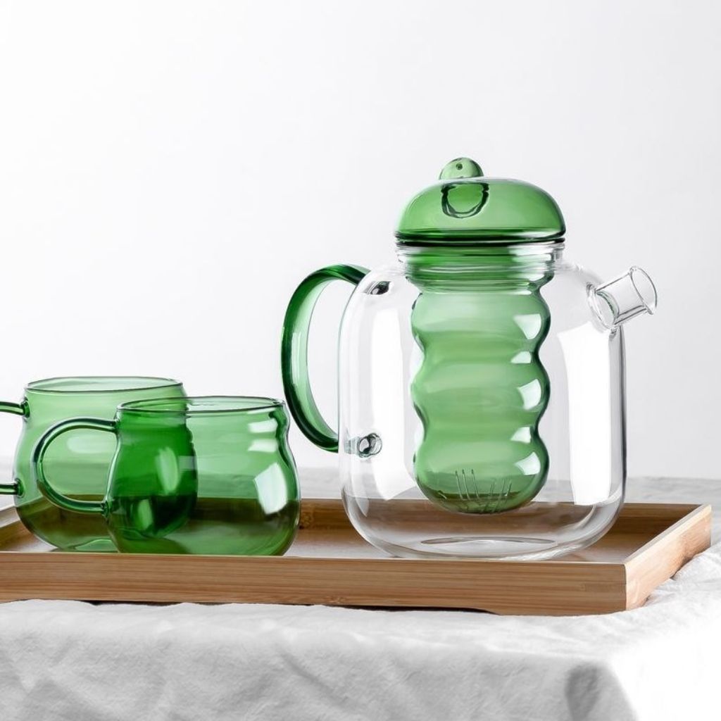 Glass teapot with built-in strainer and comfortable grip handle for serving