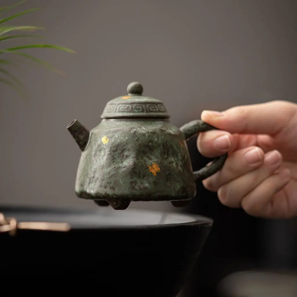 Vintage Japanese style teapot in moss bronze glaze with distinctive textured ceramic finish