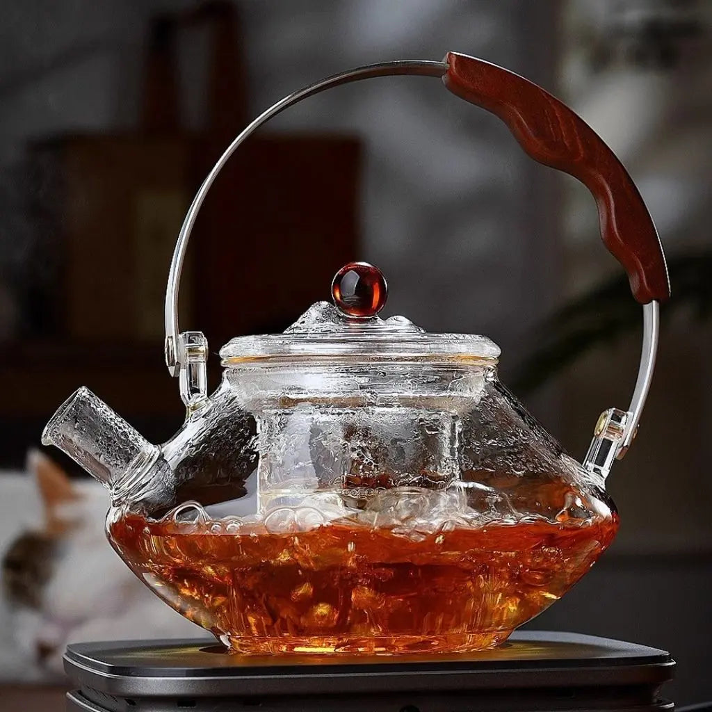 Glass tea infuser teapot with wooden handle - clear borosilicate stovetop brewing vessel