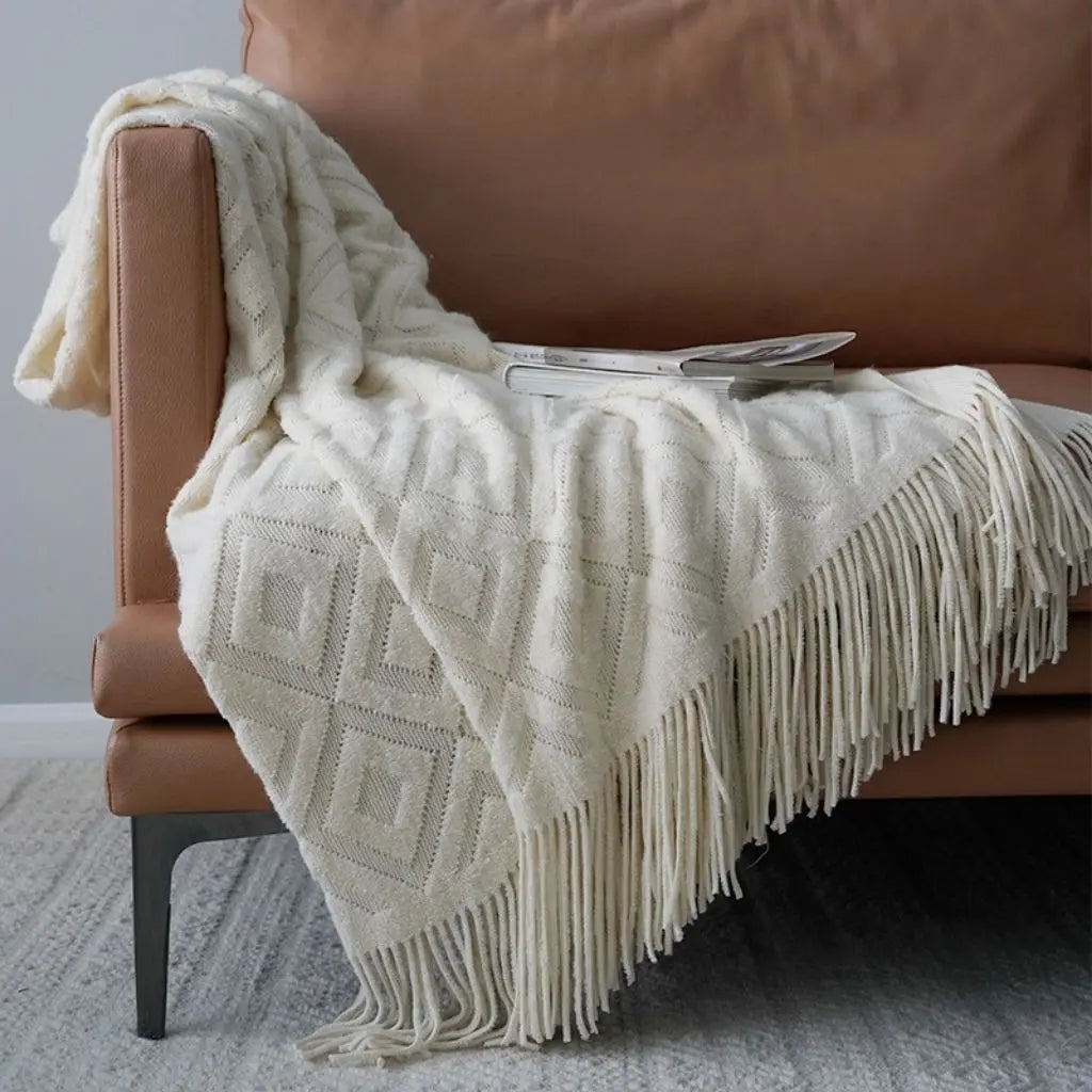 Versatile jacquard knit throw blanket suitable for beds sofas and chairs with fringe detail