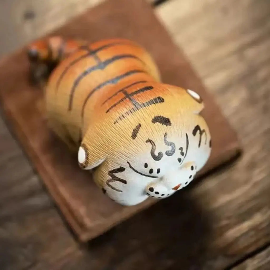 Roaring tiger tea pet figurine crafted from authentic purple sand clay for tea lovers