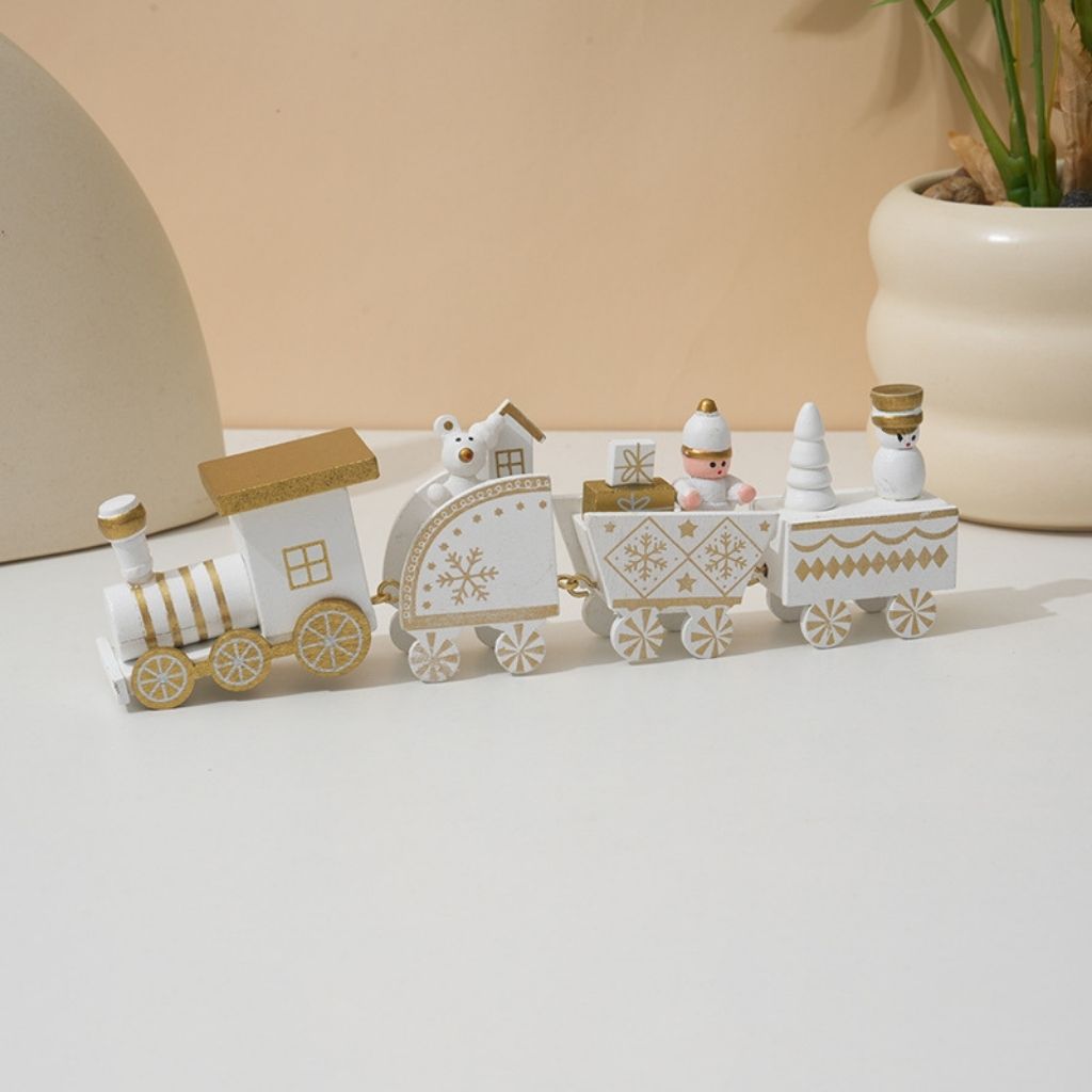 Wooden Christmas train set with detailed hand painted carts arranged in festive holiday display