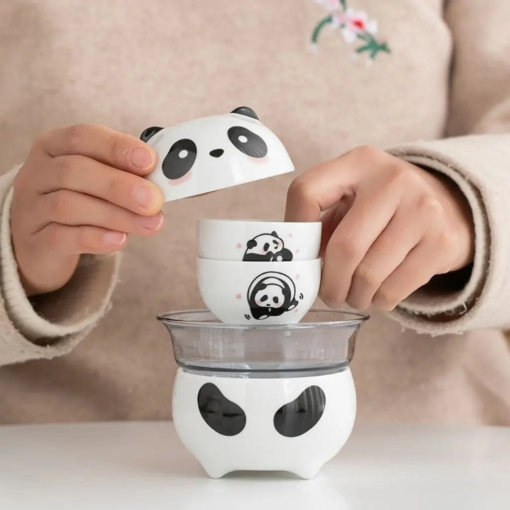 Compact ceramic tea set with adorable panda teapot cups and zippered travel case for on-the-go brewing