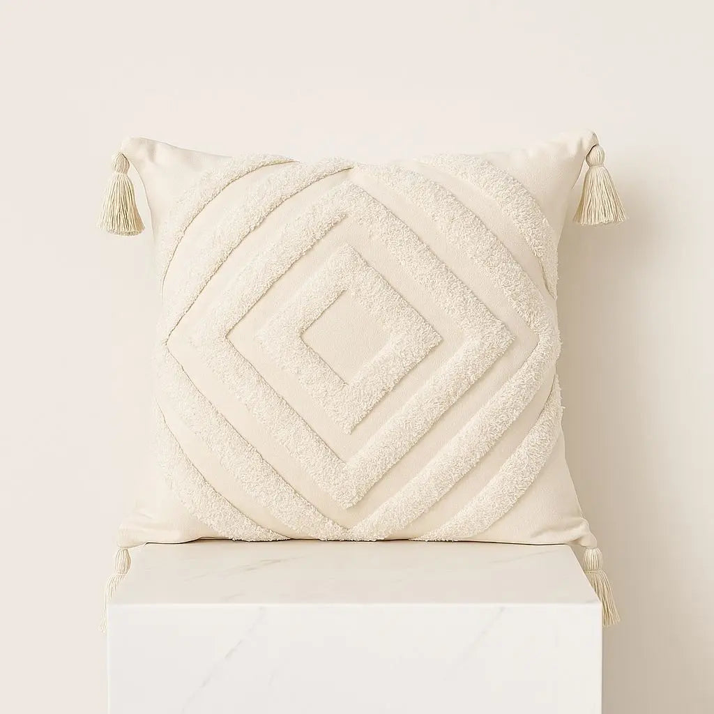 Geometric pillowcase with embroidered diamond texture and decorative corner tassels, 45x45cm size