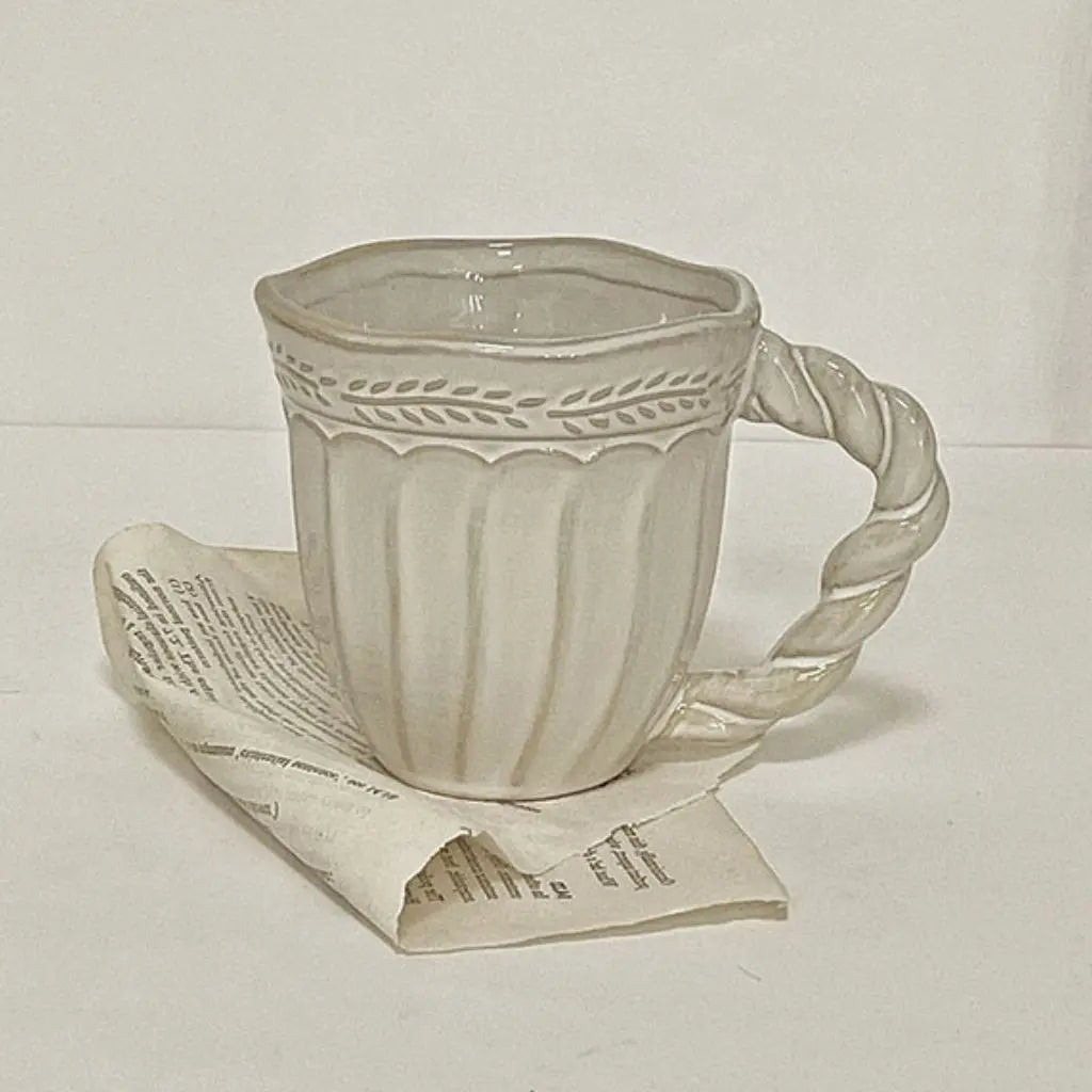 Vintage ceramic coffee cup featuring artisan craftsmanship, ideal for home coffee brewing enthusiasts