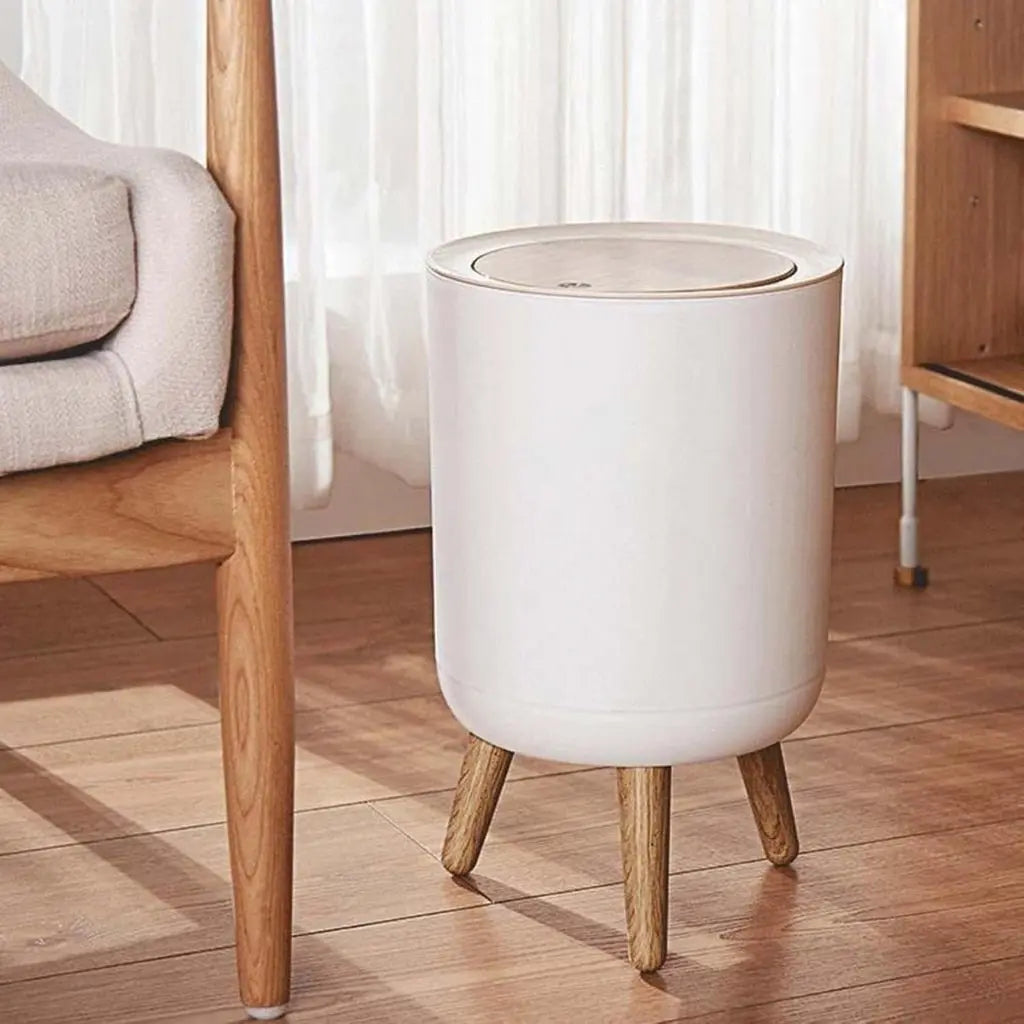 Modern trash receptacle with removable inner bin and sturdy wooden tripod stand for easy cleaning