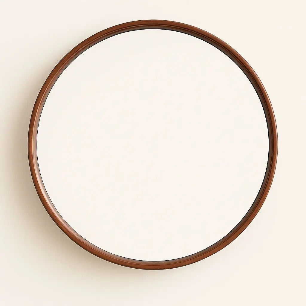 Round mirror with a wooden frame on a beige wall