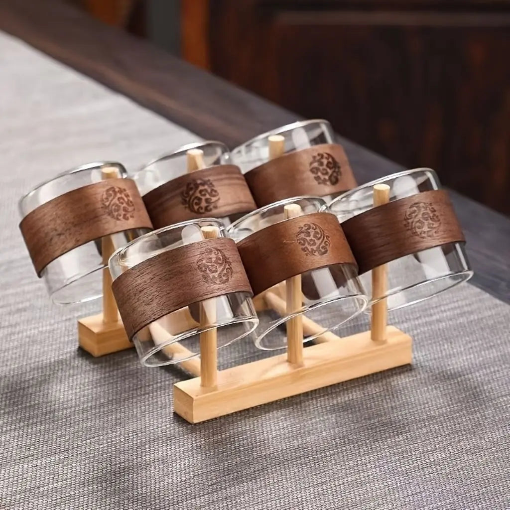 Premium tea cup featuring borosilicate glass construction and wooden handle for safe, comfortable tea serving