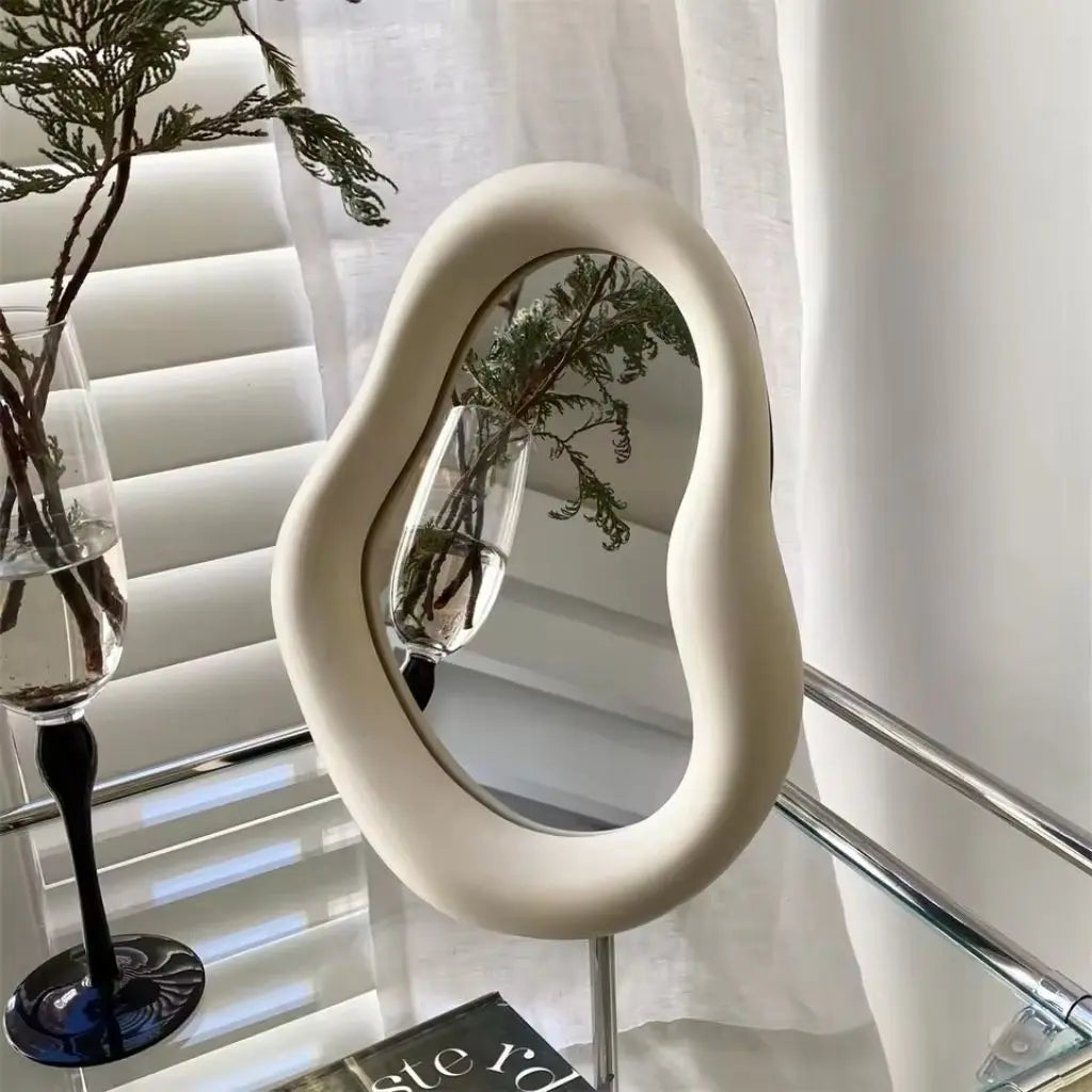 Irregular cloud mirror showing versatile wall mount